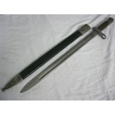 Firearm: Spanish M1913 Artillery Bayonet with Wooden Grips in its Leather scabbard 